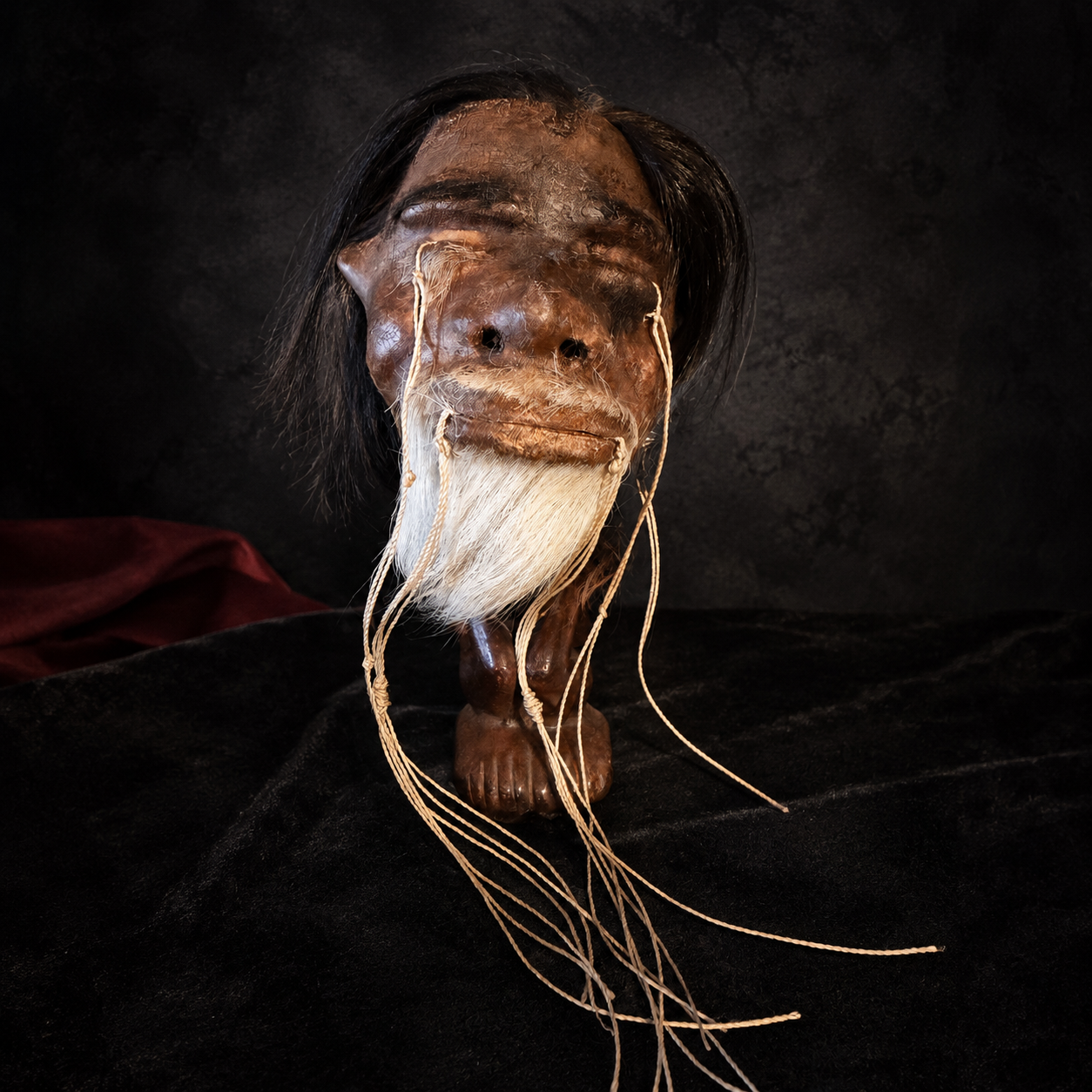 long black hair and white beard alpaca hide shrunken head replica front view