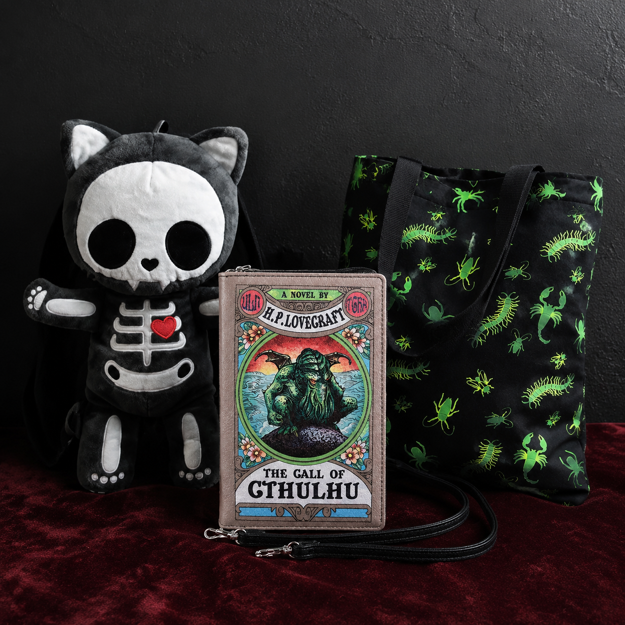 Skeleton cat backpack, Cthulhu book clutch, and creepy crawler tote from 13th Mausoleum