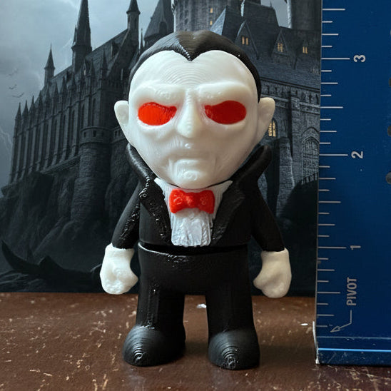 A collection of 3D printed horror-themed minifigures, featuring various characters in different poses and outfits typical of horror imagery.