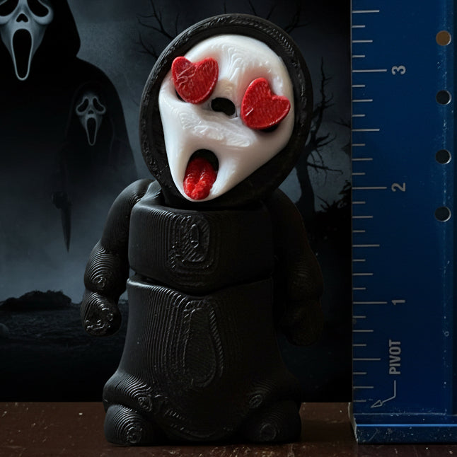 A collection of 3D printed horror-themed minifigures, featuring various characters in different poses and outfits typical of horror imagery.