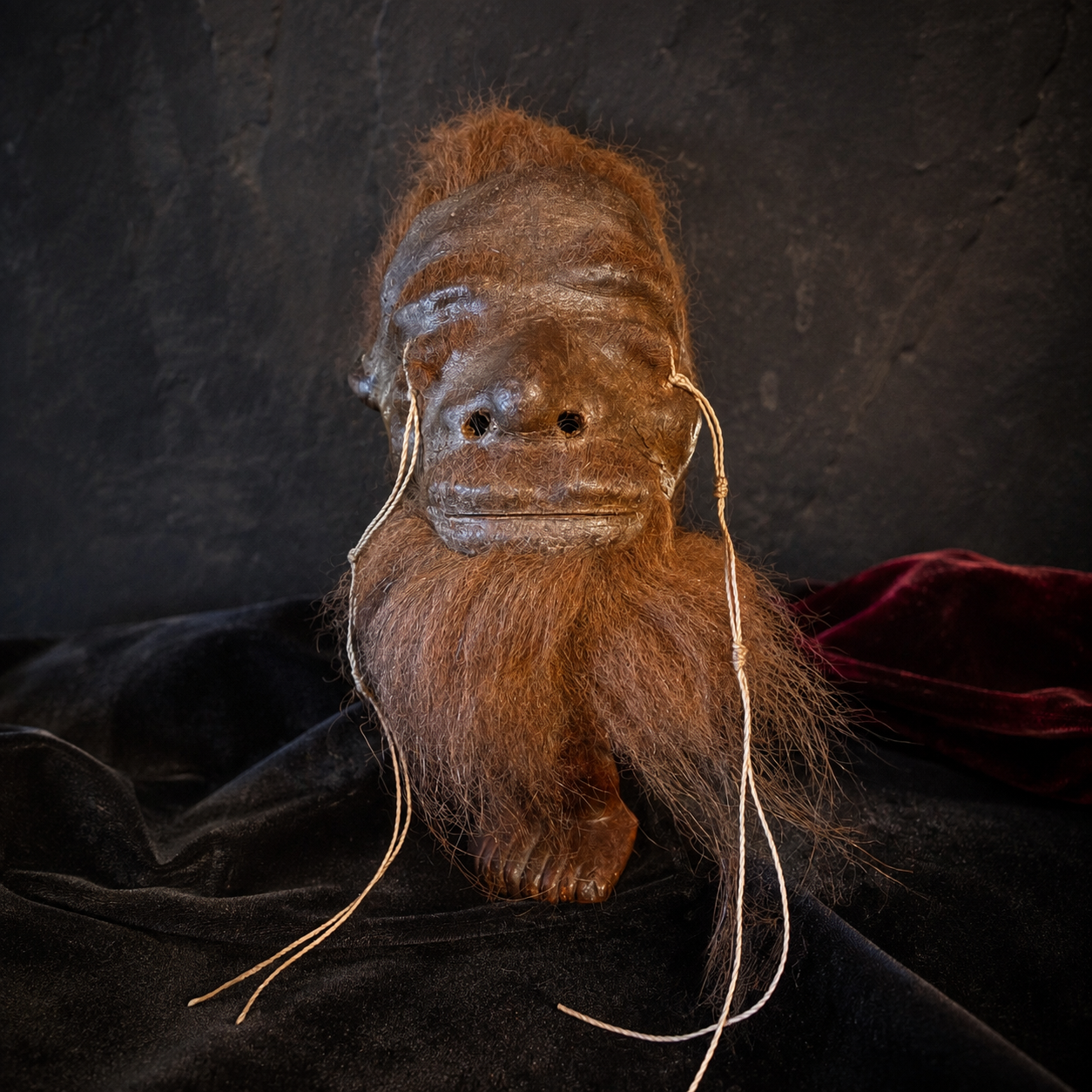 rust-haired and bearded alpaca hide shrunken head replica front view